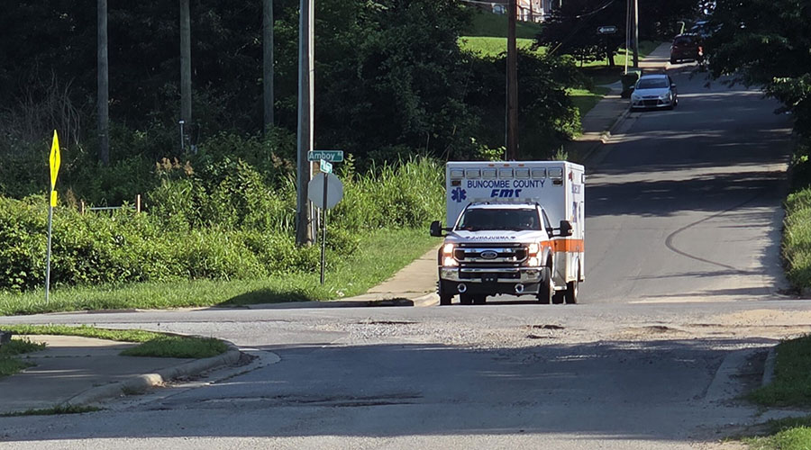 A Buncombe County ambulance crossing Amboy Road, ready to respond to the next traffic accident